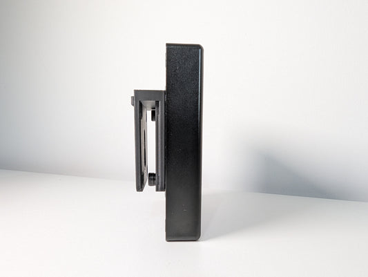 A side image of the JCSS Sim Flag. The side view shows the black aluminium housing with the 3D printed mount attached. The mount is attached by bolts, the heads of two of these can be seen.