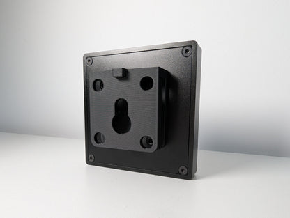 The back of the JCSS Sim Flag.  This shows the rear of the square aluminium casing with 4 bolts, one in each corner.  Attached to the back of the Sim Flag is a 3D printed mount with bolt holes so that the Sim Flag can be mounted to aluminium profile on a Sim Rig.